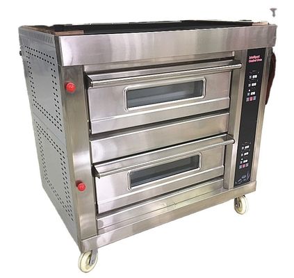 La cottura del pane di cocco rotondo è stata resa facile con la macchina a forno a grande mazzo alla pasticceria Pie Long Loaf